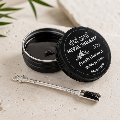 Nepal Shilajit container with a spoon on a light background