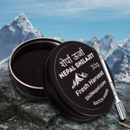 ShilNepal Nepal Shilajit container with a spoon and with a mountainous background
